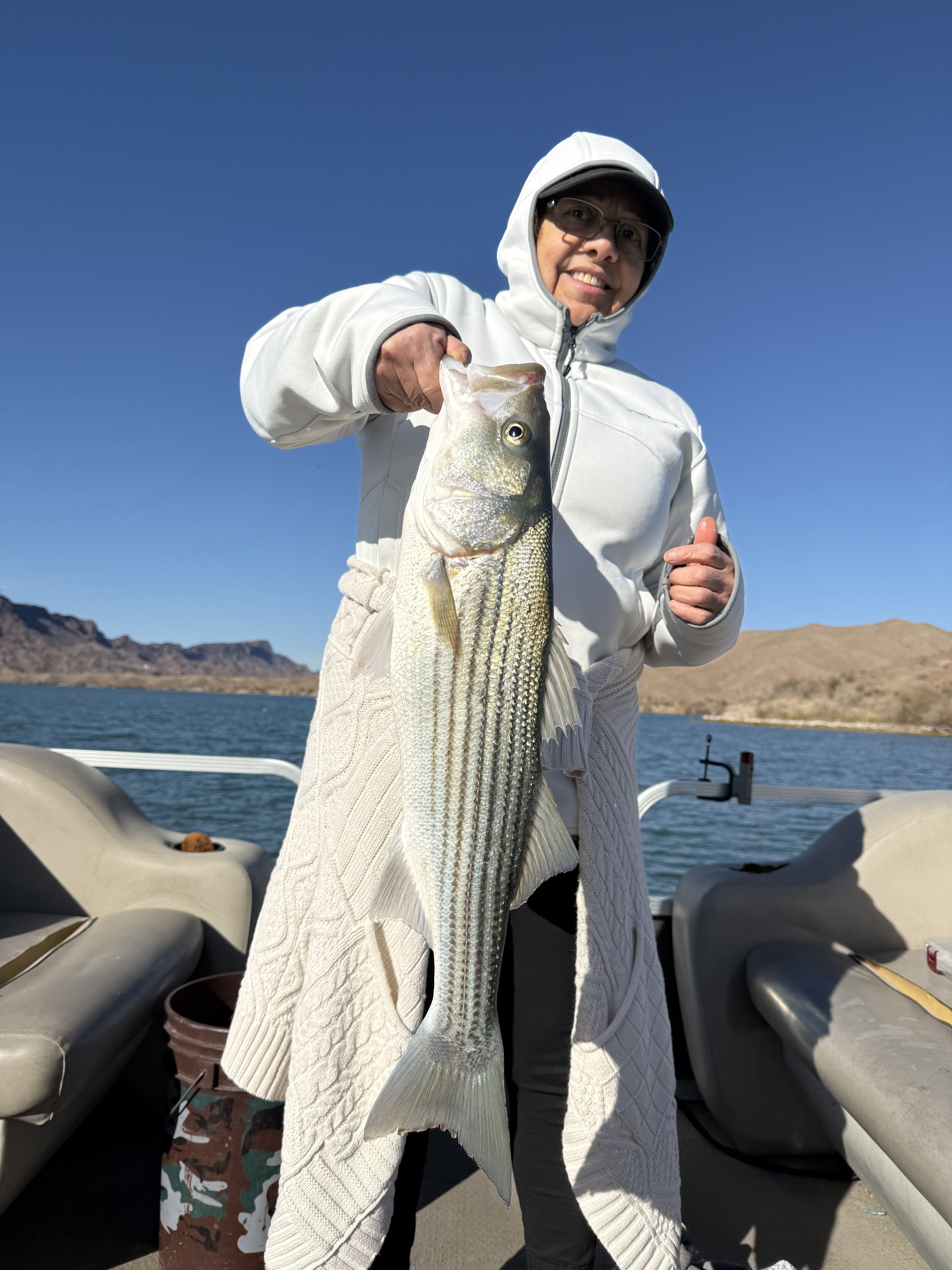 Angler with striped bass